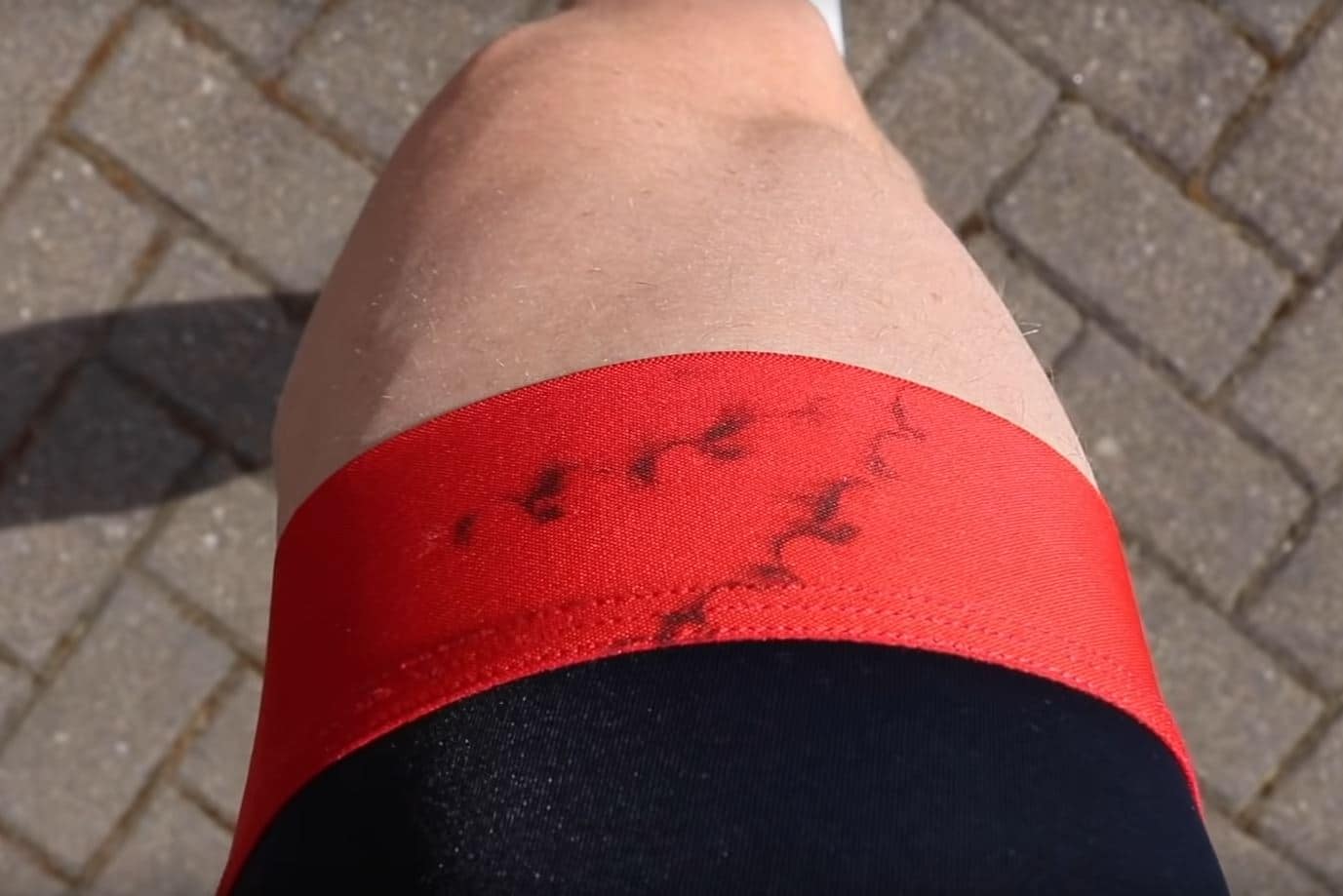 black and red bike shorts with oily chain stains