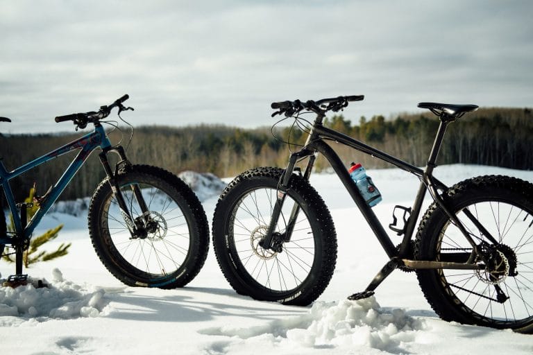 two fat bikes suited for overweight people over 400 lbs sitting in the snow