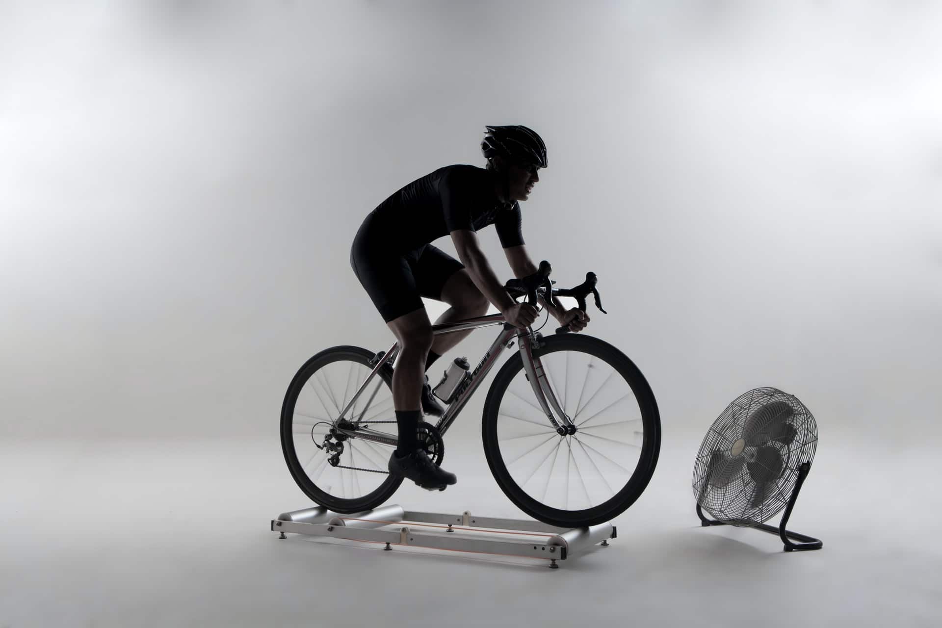 cyclist riding on the stationary indoor bike stand
