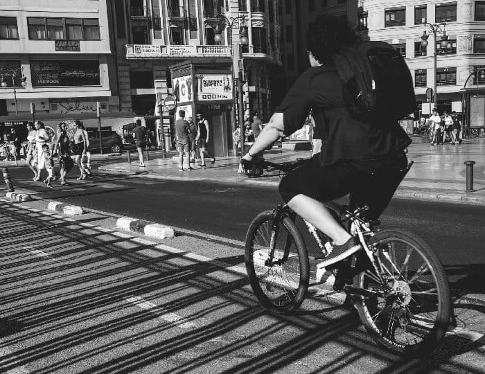 overweight young man riding on bicycle