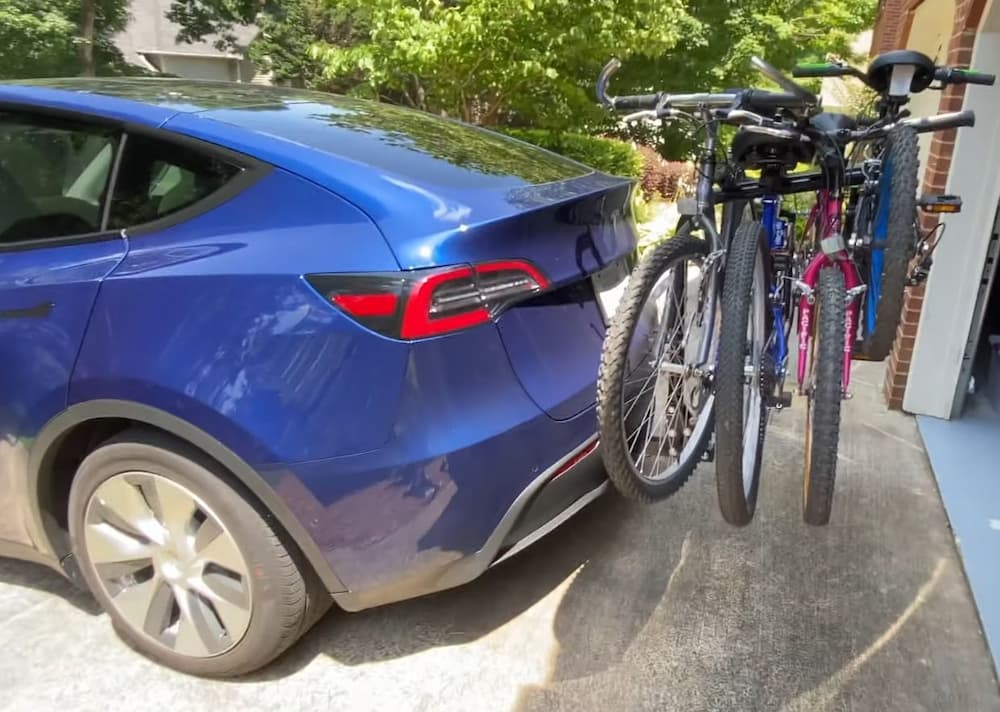 tesla model y with hitch bike rack and 3 bikes