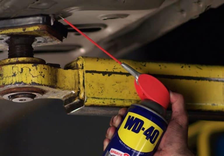 mehanic spaying WD40 from a can