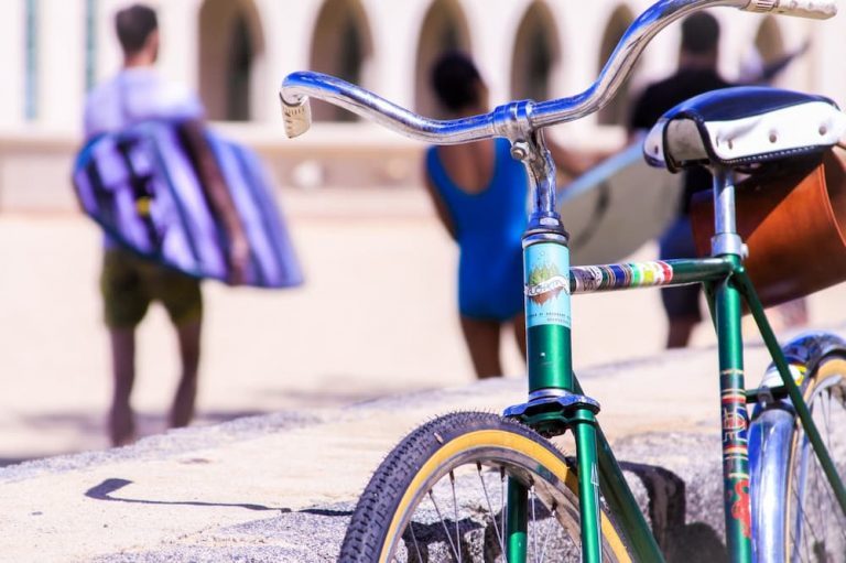 How To Carry A Surfboard On A Bike?