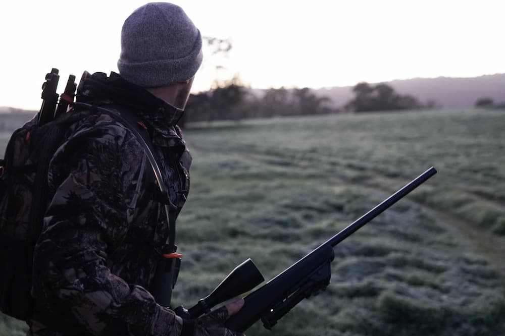 cyclist hunting with rifle