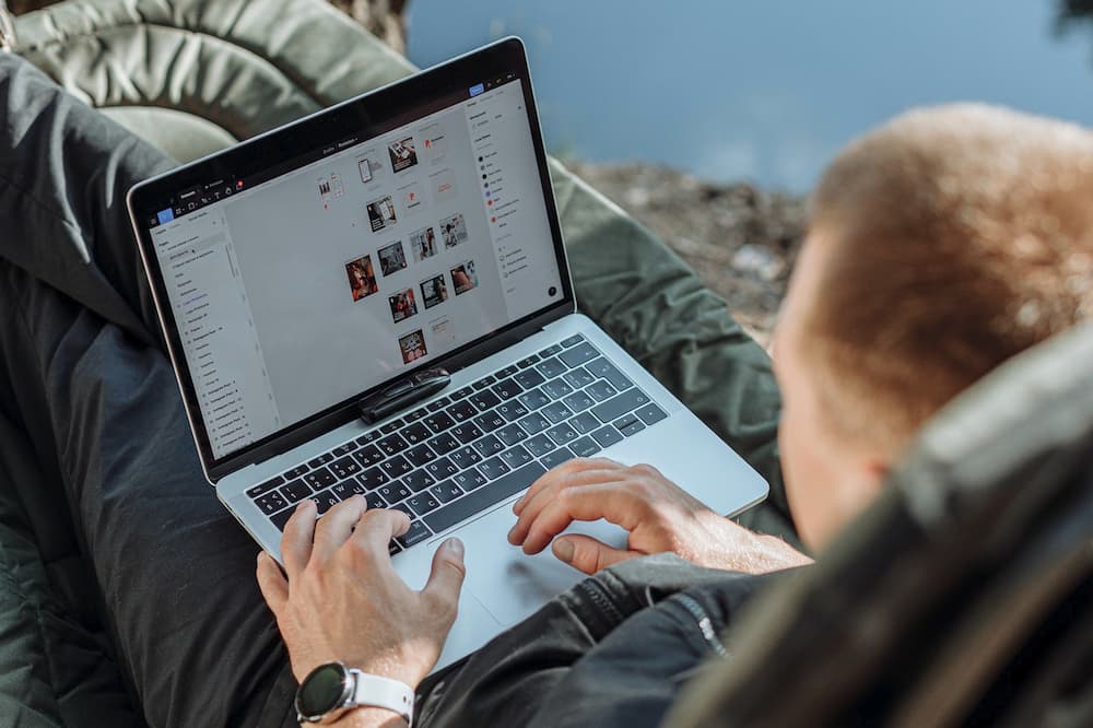 cyclist using laptop outdoors