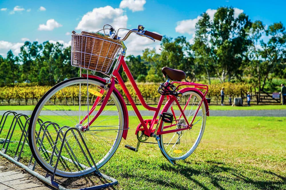 red step thru bike with metalic front bike basket